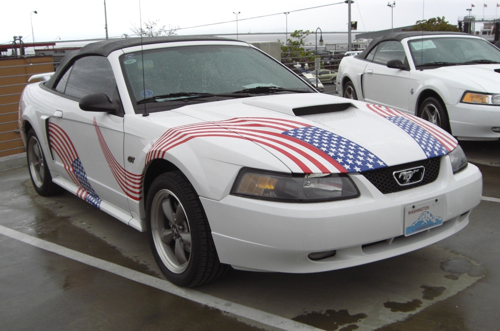 Oxford White 2001 Mustang GT with red white blue flag graphics
